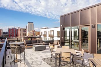 Sundeck with firepit and rochester skyline views